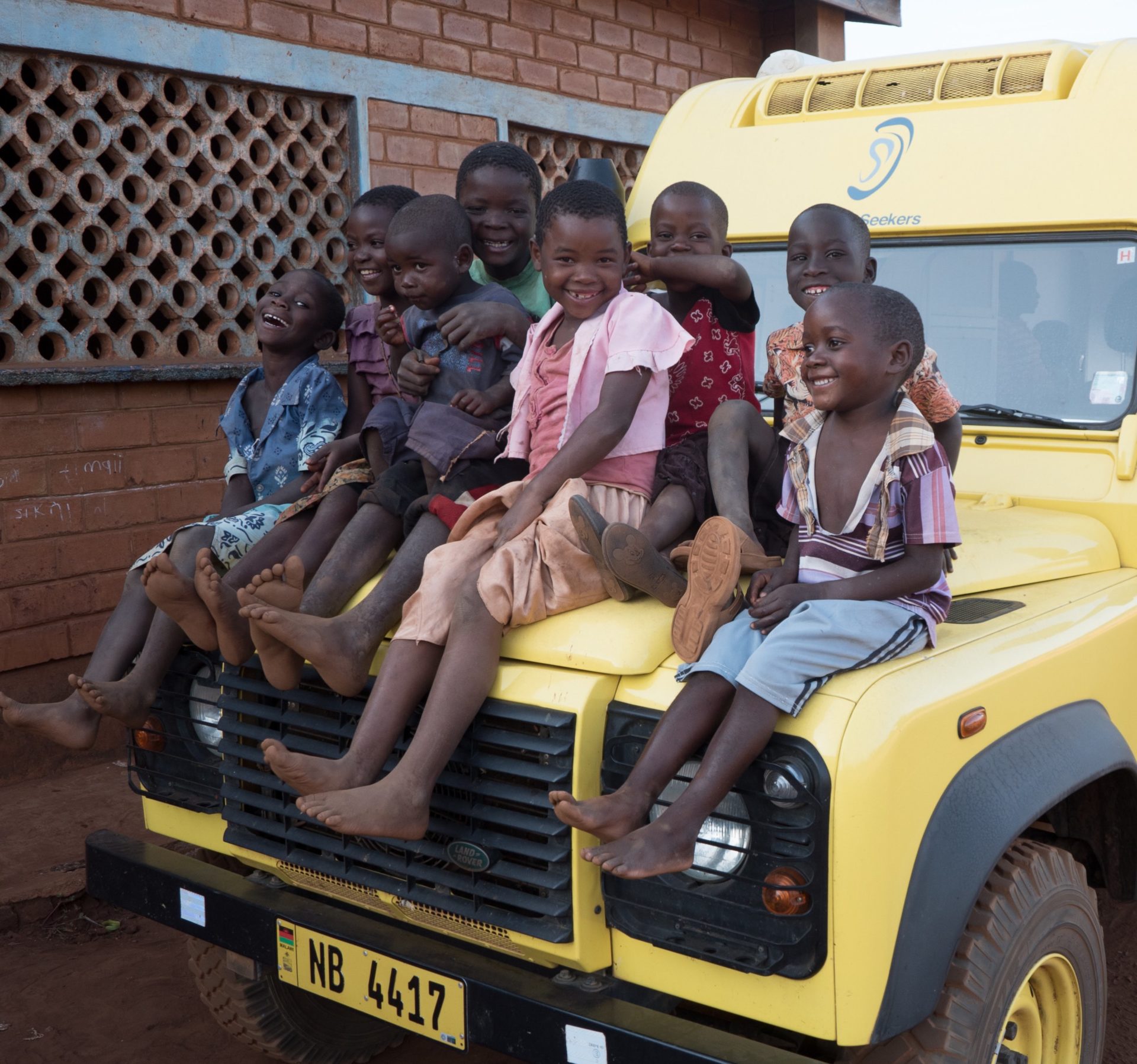 kinds sitting on truck in Zambia