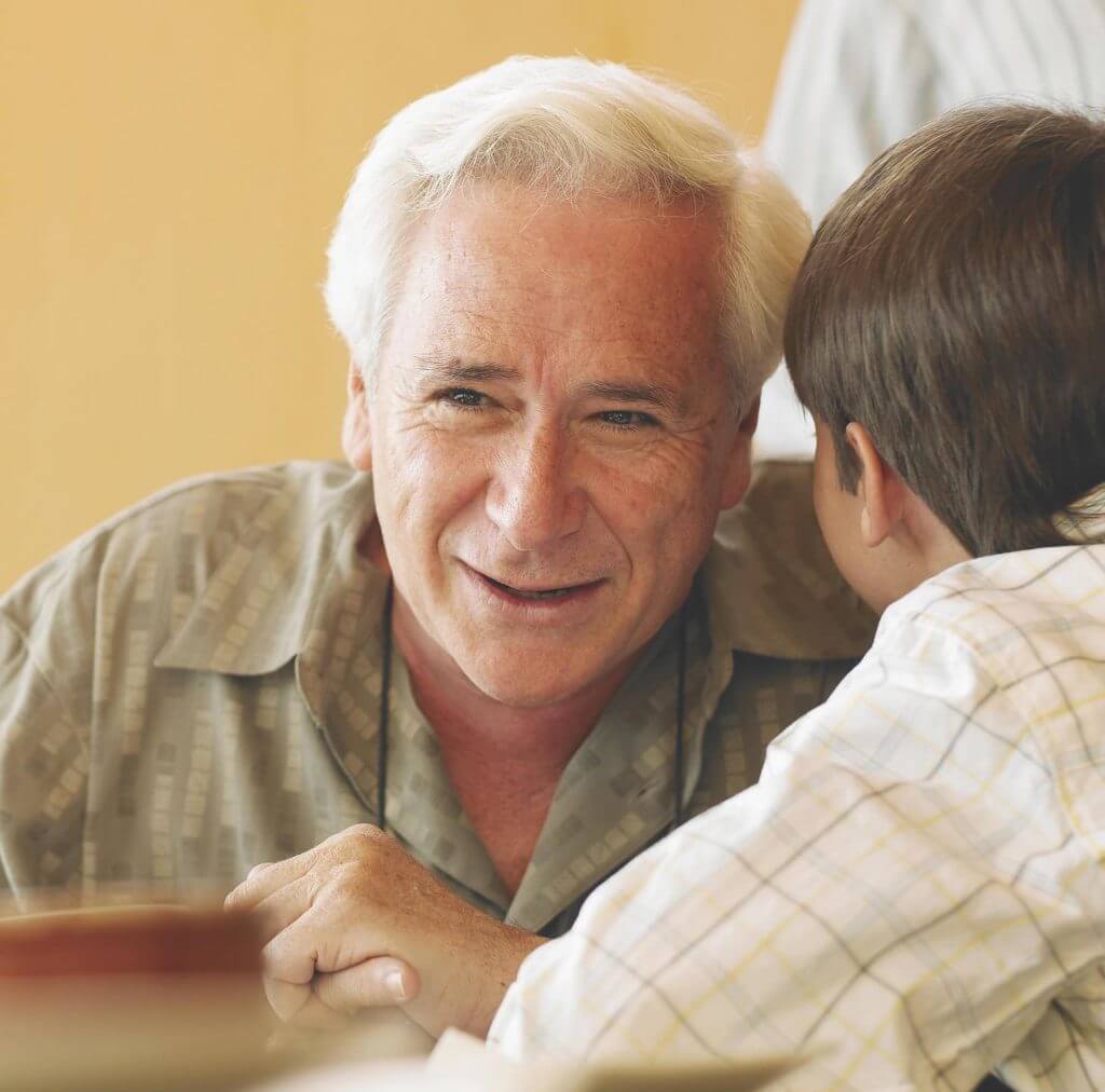 old man with hearing aid