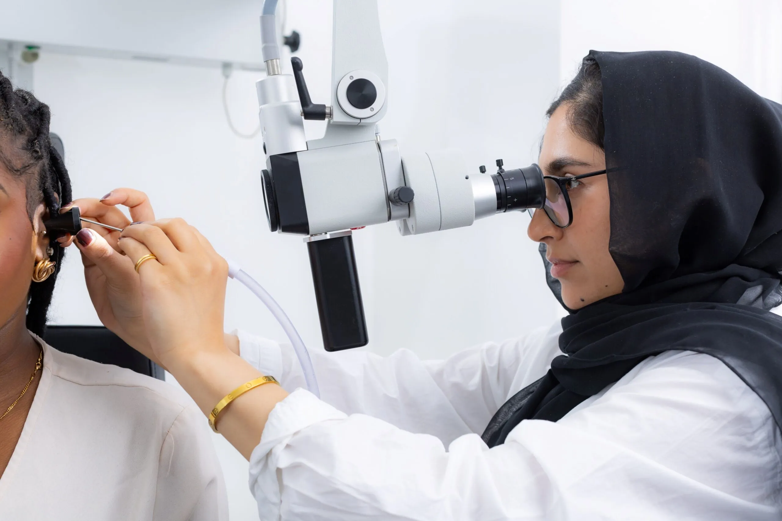 audiologist inspecting ear canal